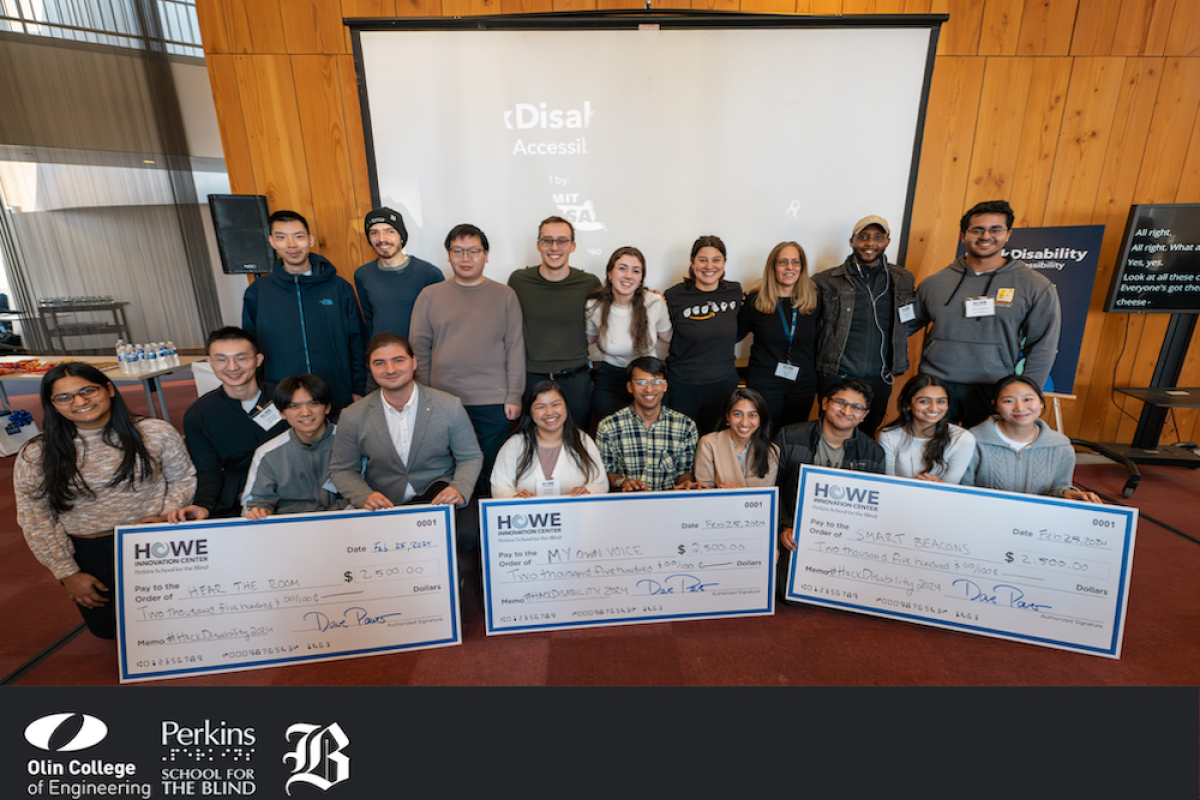 Three teams pose with their winners checks at the Perkins School for the Blind's AI Hackathon in February 2024.