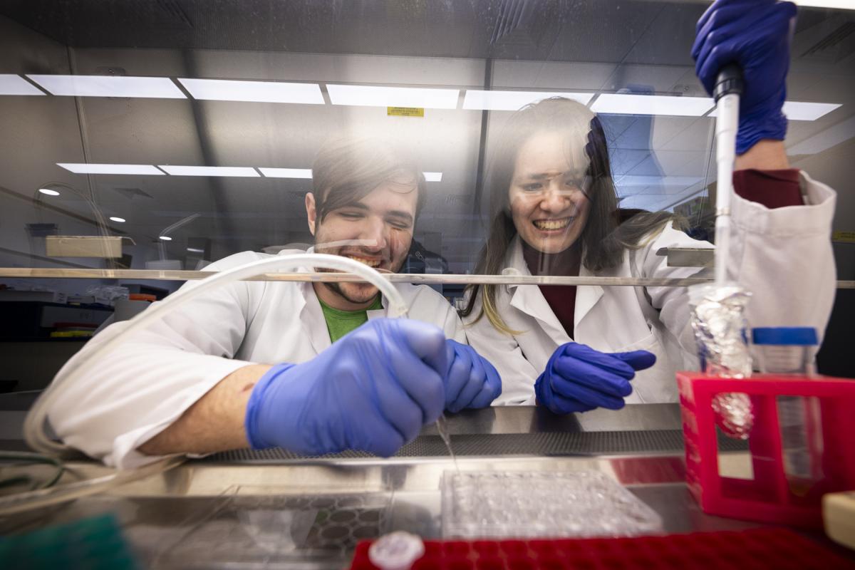 Two Olin students working with organoids under the fume hood. Image by Tom Kates.