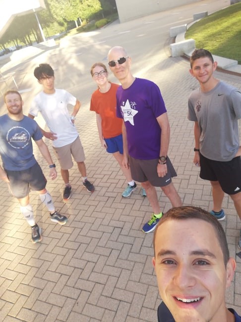 A group selfie of people ready to go for a run.