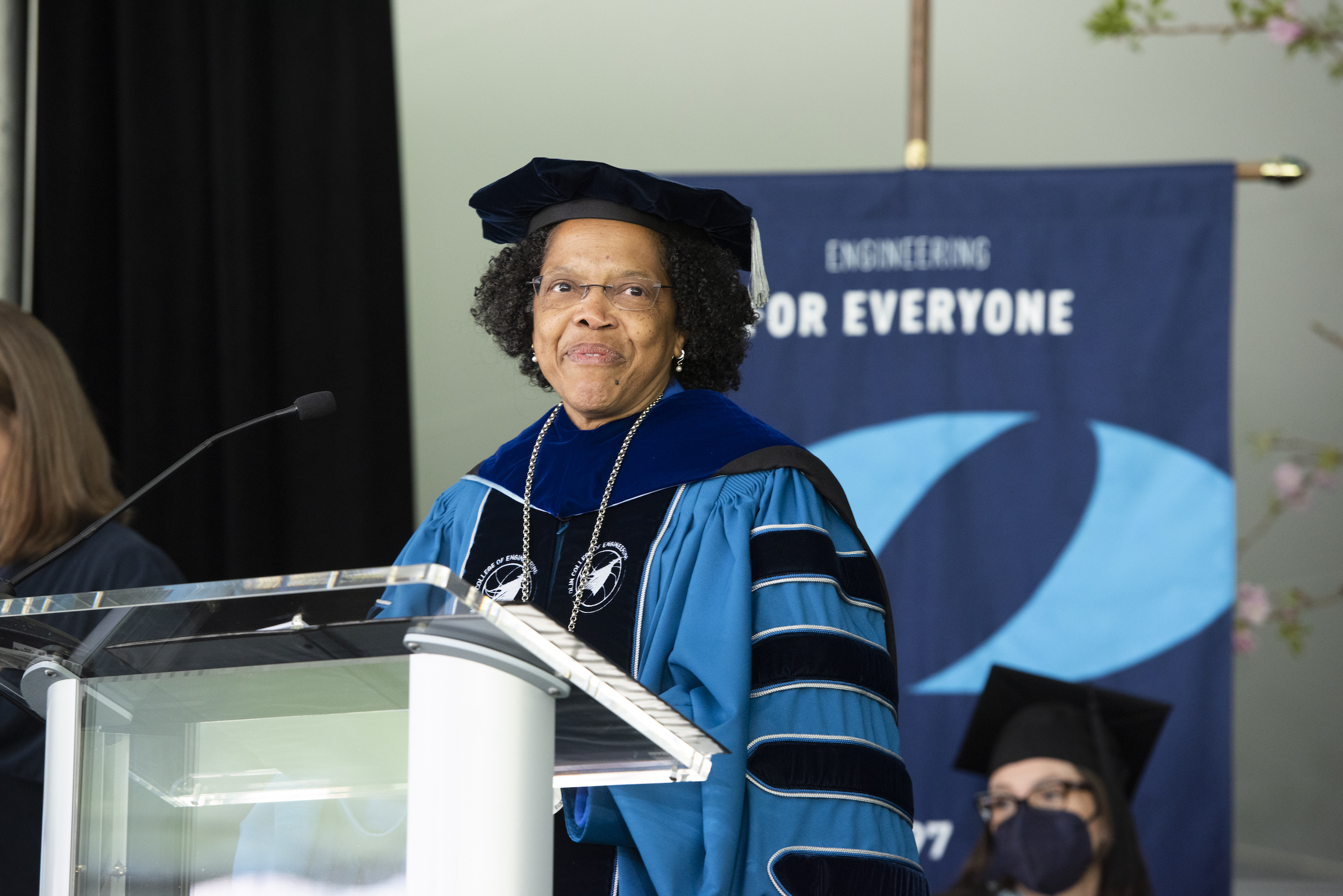 Olin President Gilda Barabino stands at the podium during her Inauguration ceremony on May 2022.