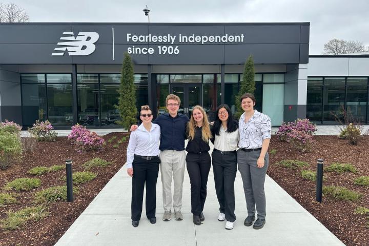 Five students outside of New Balance HQ