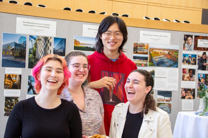 Four Olin seniors share a laugh in the Milas Hall Mezzanine 