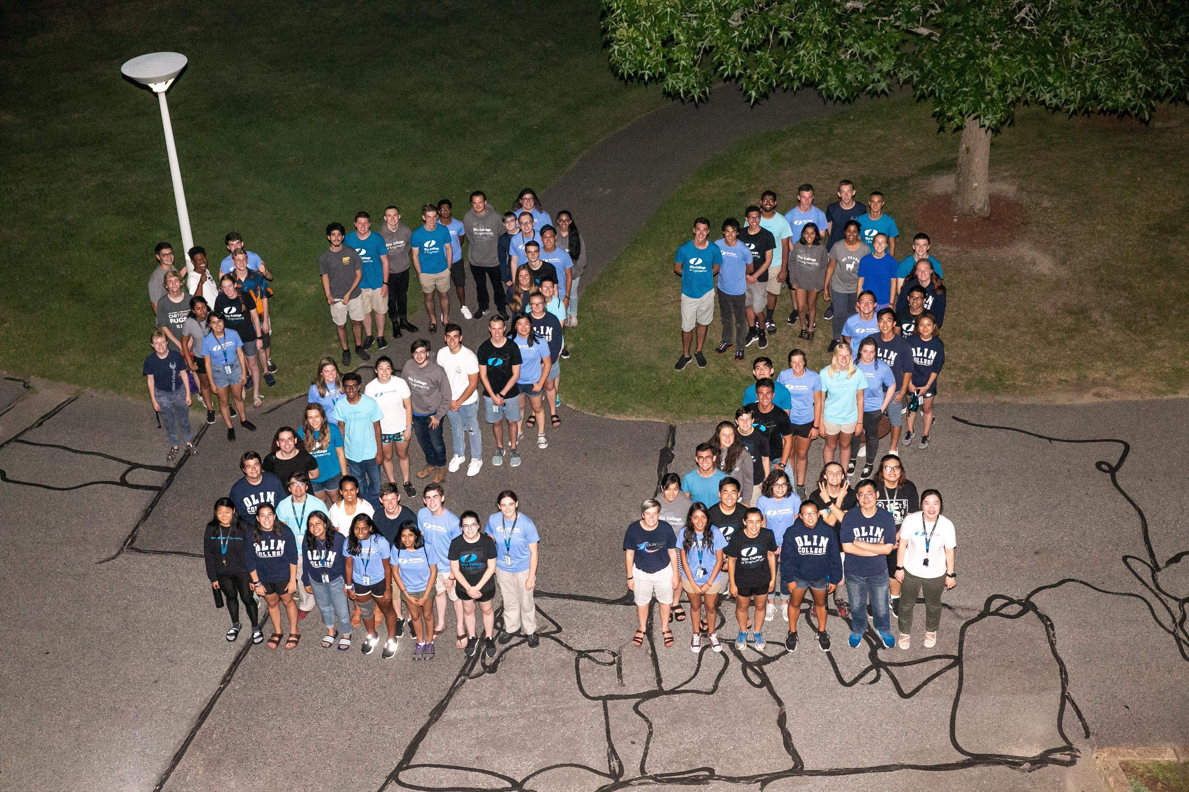 Aerial shot of students wearing Olin shirts forming "22" to indicate their graduating year.