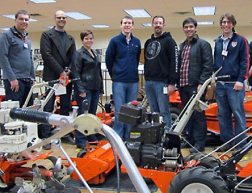 Team members standing around their build