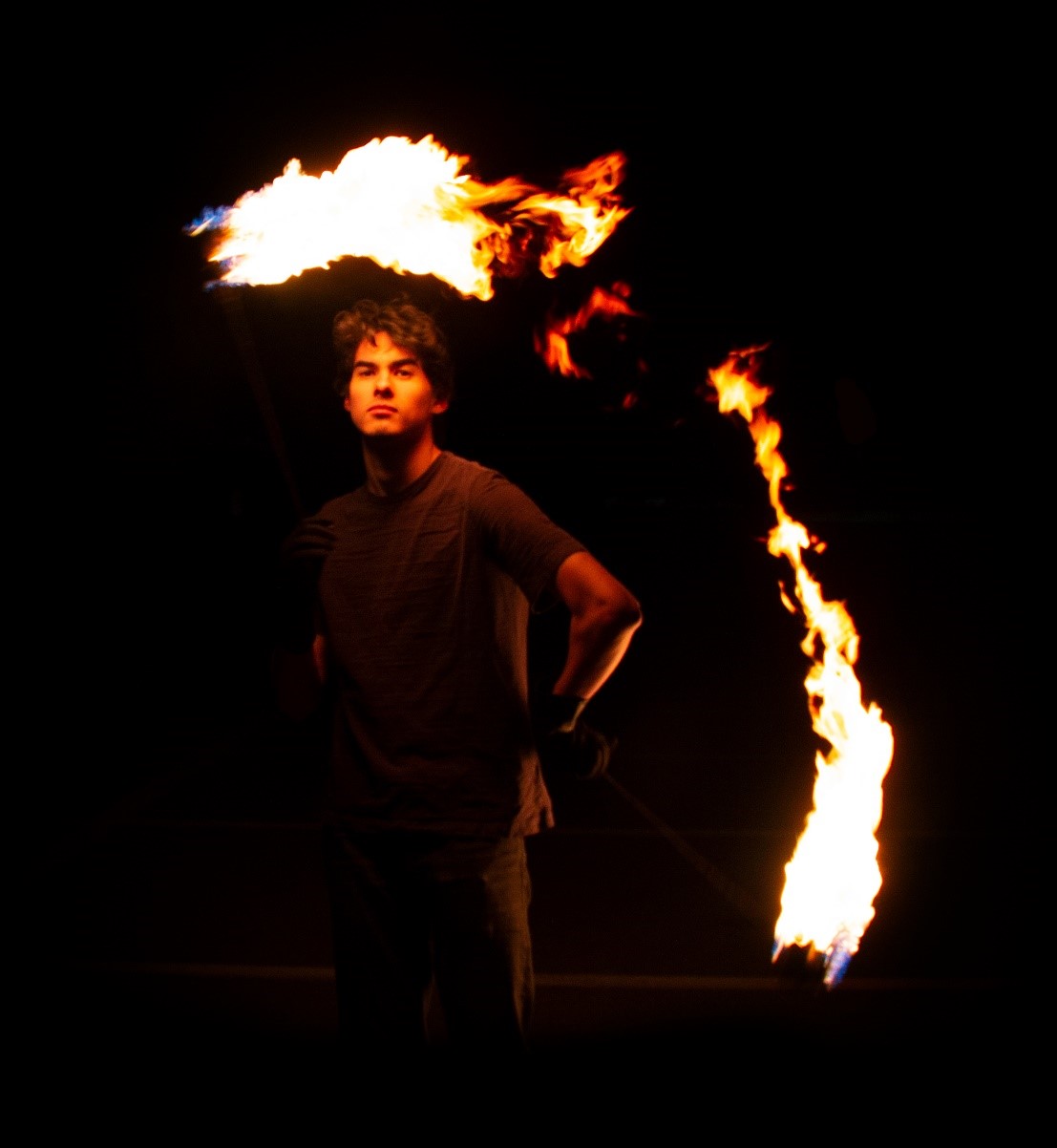 The author spinning fire with the Olin Fire Arts Club.