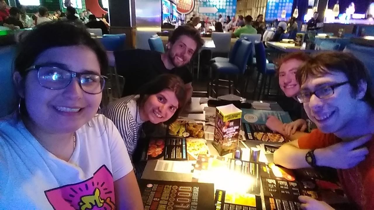 The author with a group of friends at a restaurant.