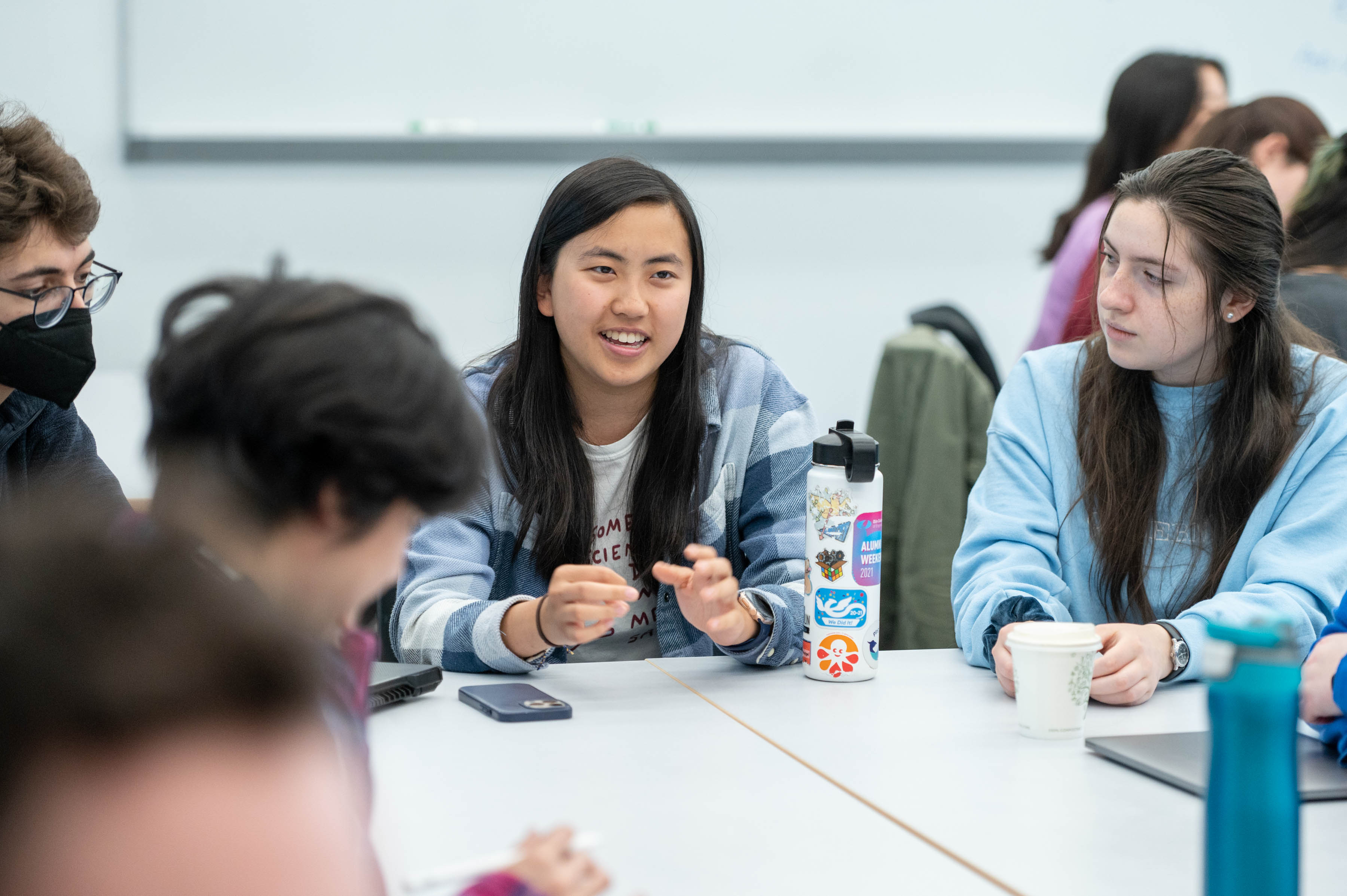 Maya Lum'23, Tigey Jewell- Alibhai'23, Allison Li'24, Cara Mulrooney'24 pictured left to right respectively working on Engineering in Context group activity.