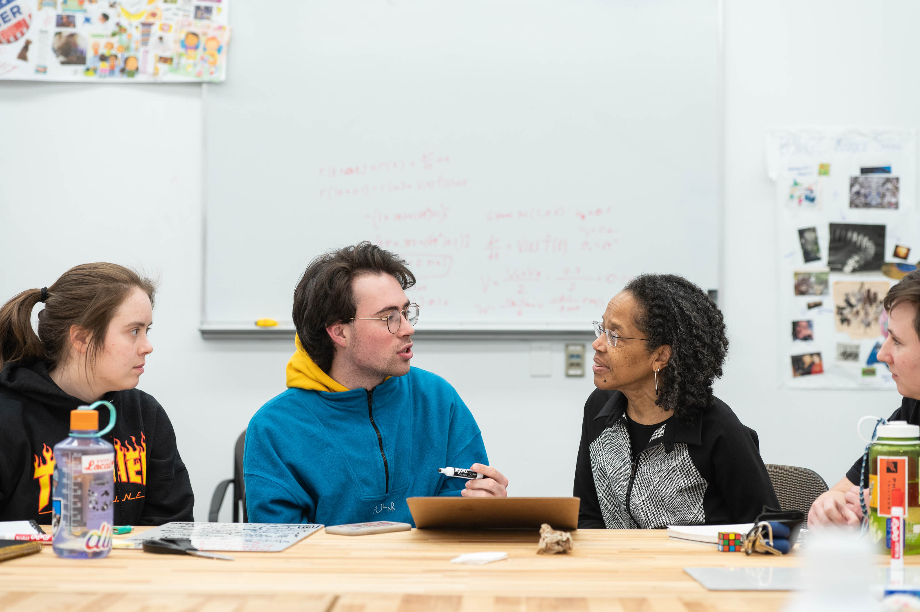 Olin President Gilda Barabino pictured seated in class talking to students.