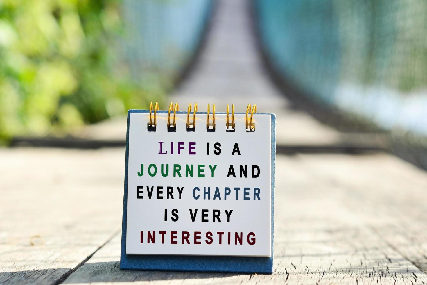 Sign that says "life is a journey and every chapter is interesting"