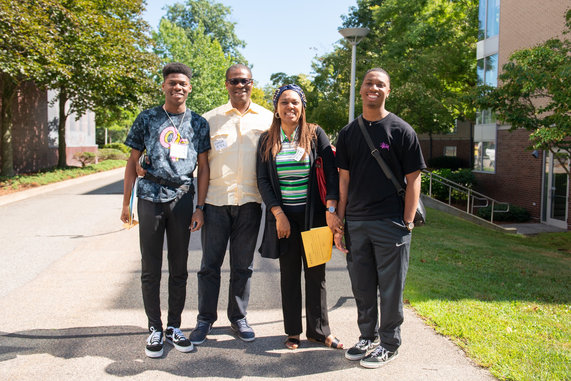 A family of four on a college campus.