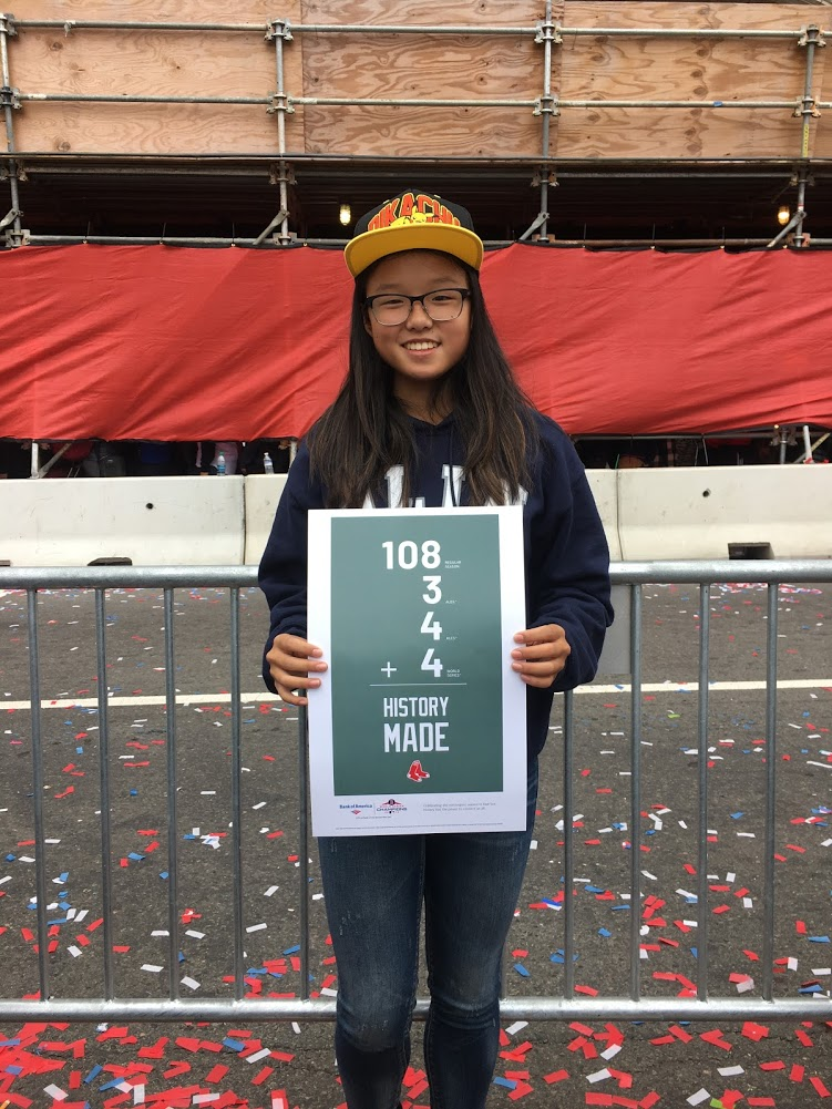 The author holding a Boston Red Sox poster.