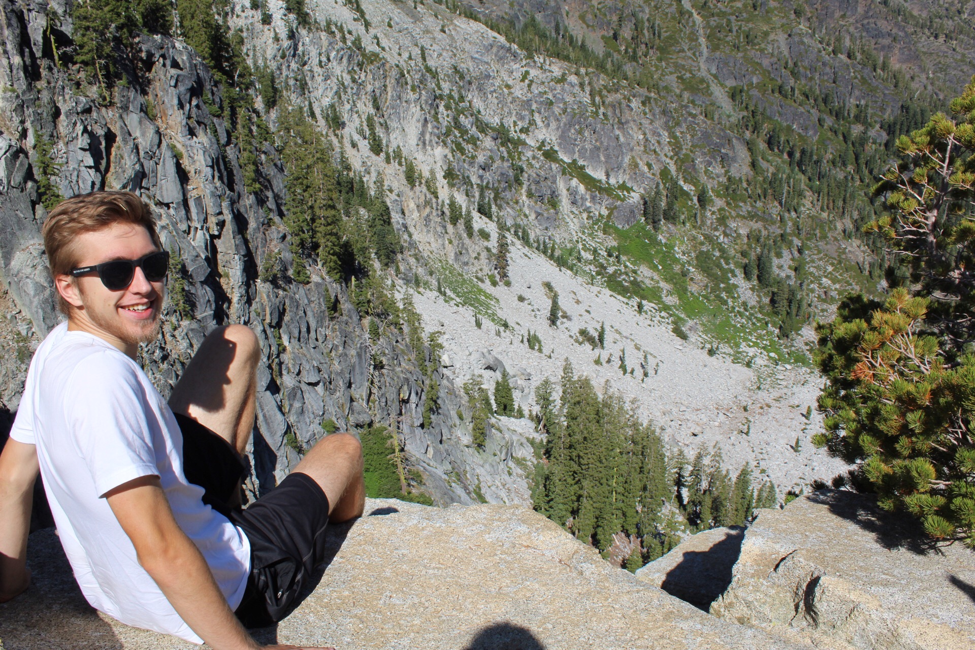 The author sitting on a mountain.