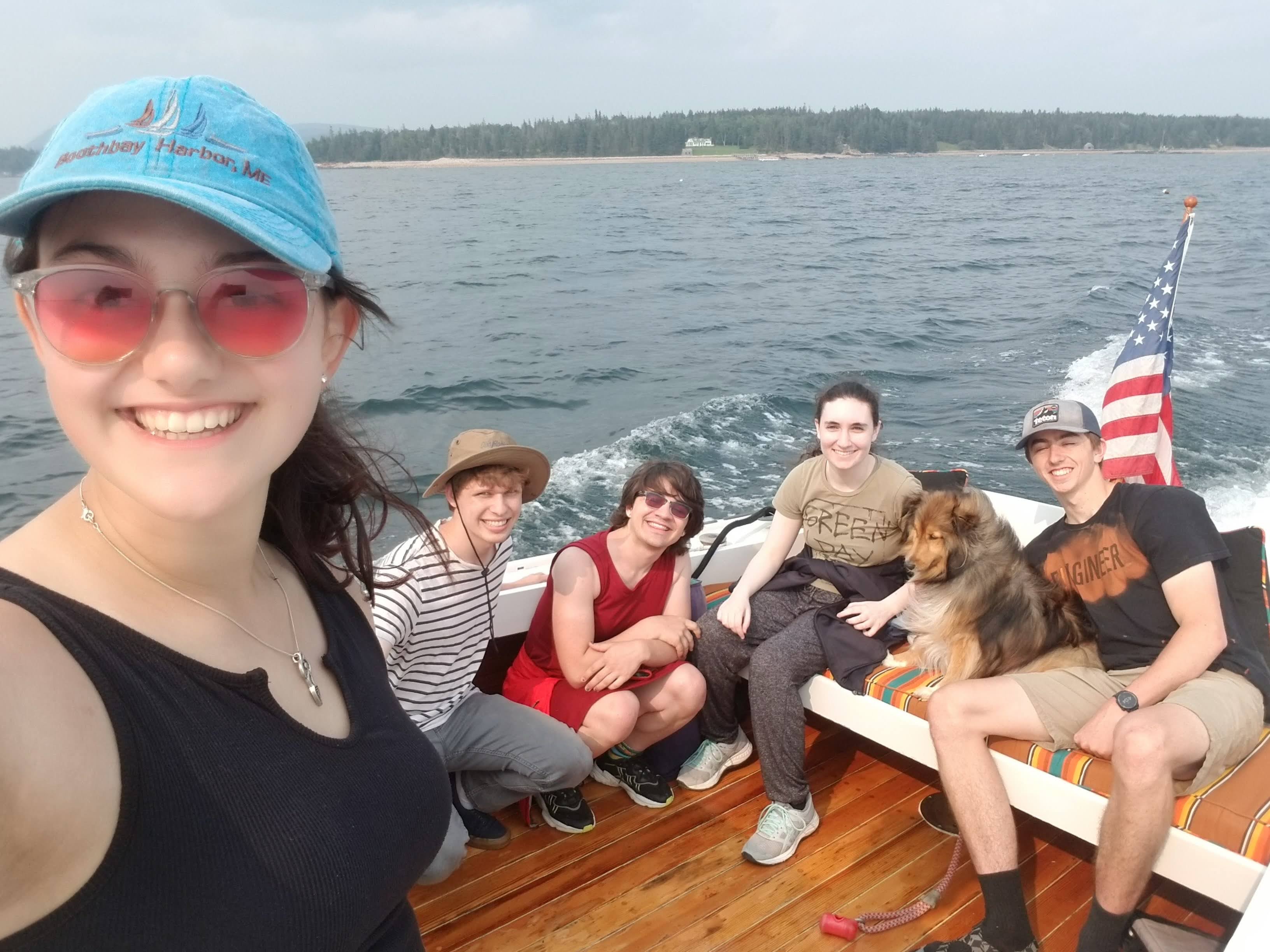 Sofia and her team on a boat in Maine