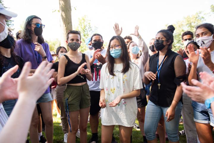 A group of students standing together outside during orientation