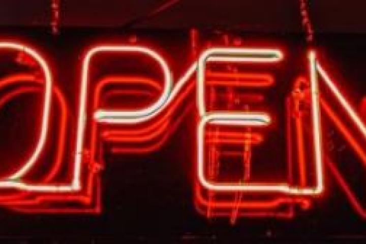 A neon sign that says "OPEN."