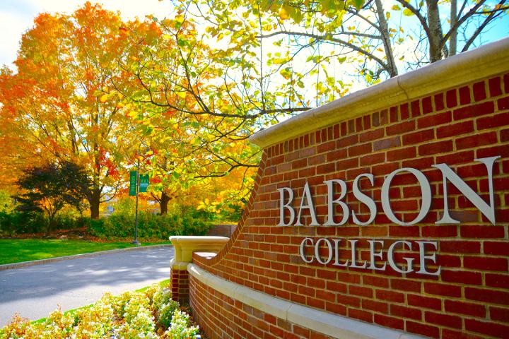 a photo of a brick sign that reads "Babson College"
