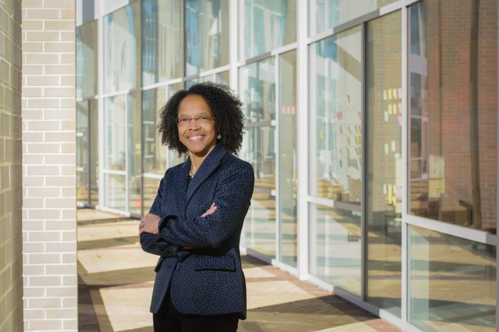 Olin College President Gilda Barabino poses with a smile outside Olin's Academic Center in 2020.