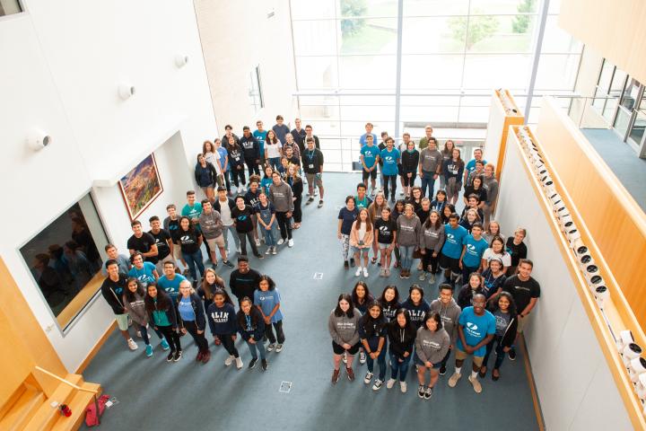 A photo of the members of the Olin College class of 2023 arranged into the number two and the number three