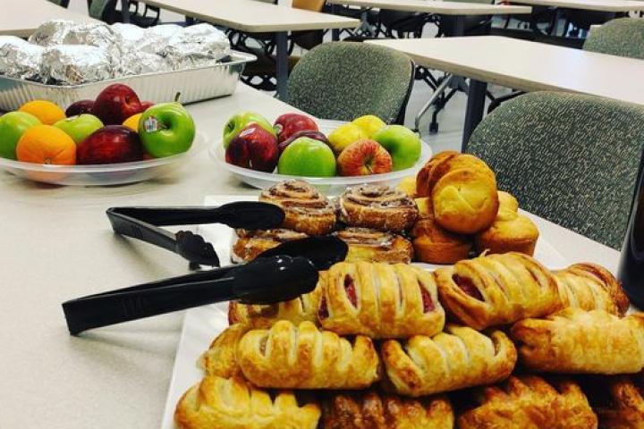 A photo of pastries and fresh fruit on a table