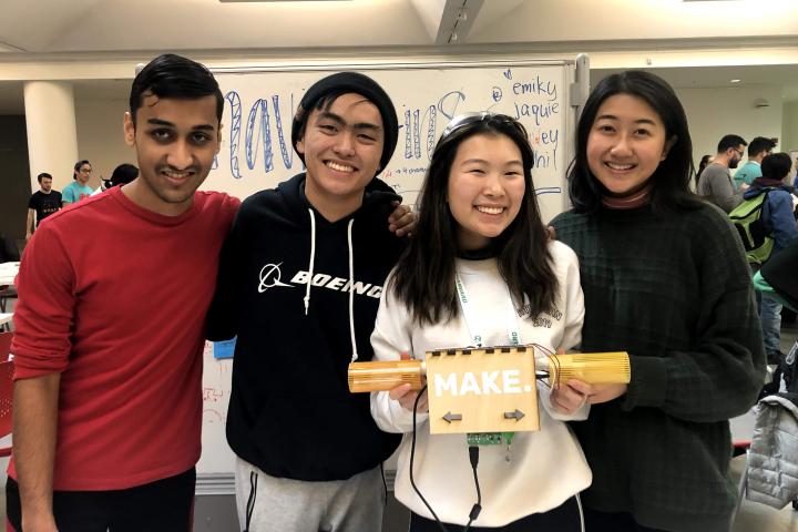 Four Olin students pose for a photo at MakeHarvard 2020 hackathon