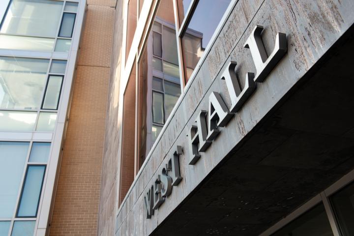 The silver West Hall residence building sign