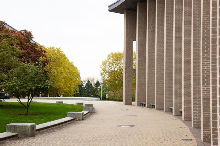 A photo of a row of columns on a large, long building