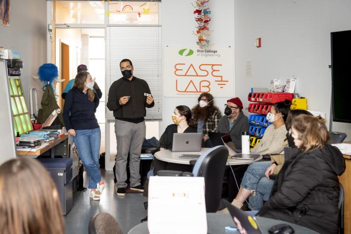 A group of people collaborating in a classroom