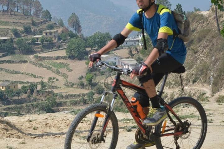 Olin College Student ambassador Vedaant Kuchhal A photo of a person riding a bicycle