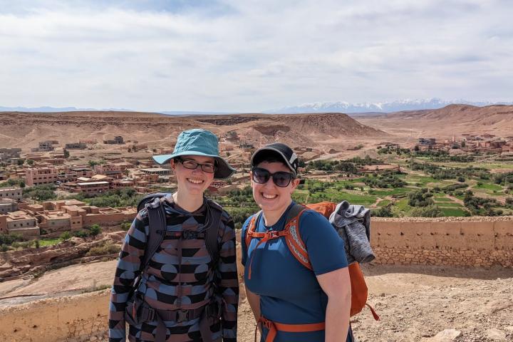 Two people pose for a photo while hiking in Morocco March, 2022
