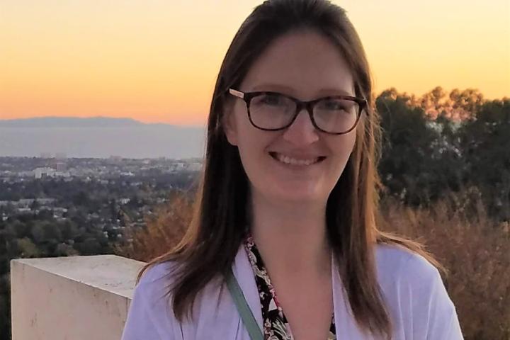 Evelyn Matsumoto, Operations and Event Specialist at Olin College of Engineering woman in glasses in front of sunset