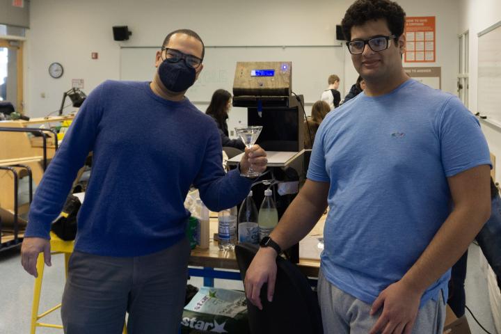 Professor Anom Millner and Albert '25 with the PIE project "Bar Bot." Professor Anom Millner and Albert '25 with the PIE project "Bar Bot."