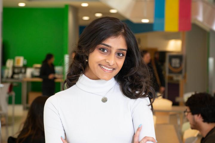Rishita Sarin '23 poses for a Humans of Olin photo in the Dining Hall.