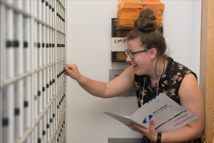 student accessing campus center mail box on move-in day 2016