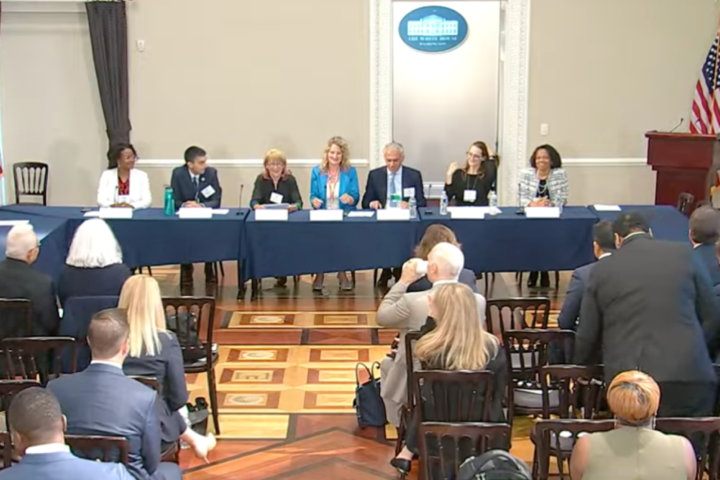 President Barabino at White House Summit President Barabino and panelist sitting down at White House Summit