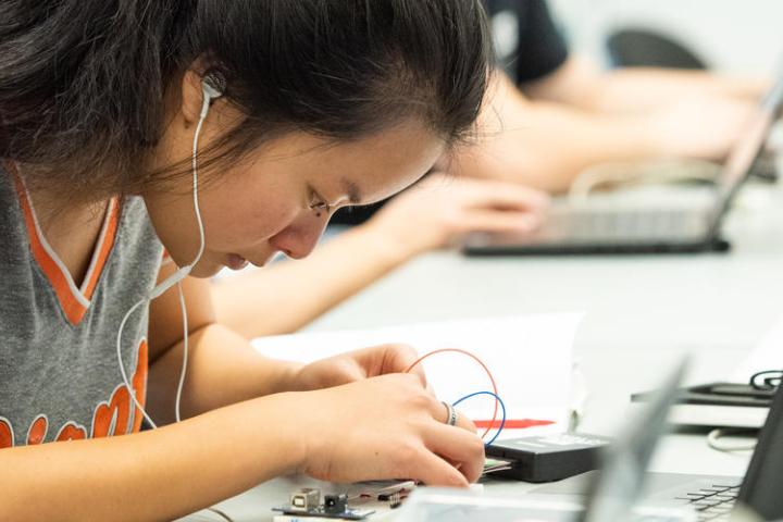 female student working on circuits