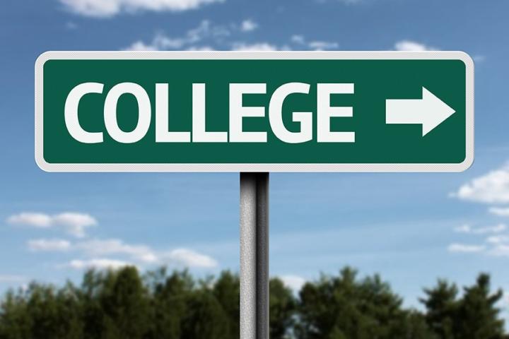 Blue sky and trees with street sign saying "COLLEGE" with arrow pointing right