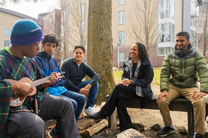 MIX BBQ - Olin student playing ukelele to fellow students and President Barabino