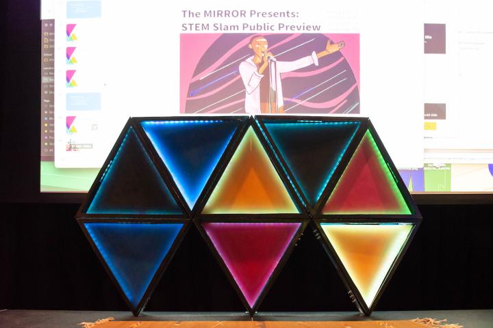 The MIRROR Stem Slam 2023 A photo of a grouping of triangles shaped to represent an M