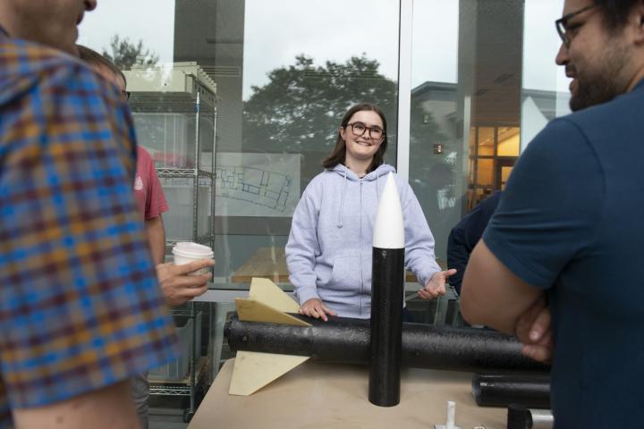 Olin student Cassandre Roos '25 talks to people during a recent project team fair.