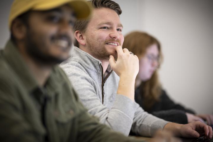 Close up of Olin students in classroom smiling