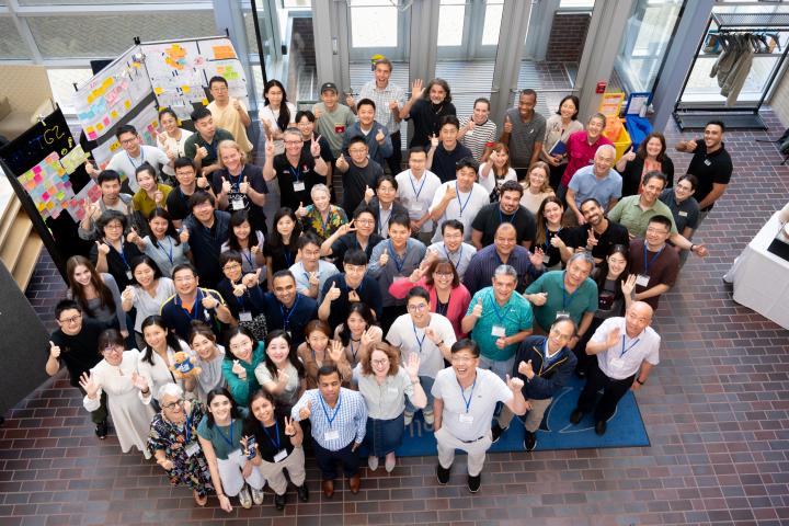 Overhead photo of all summer studio participants giving a thumbs up