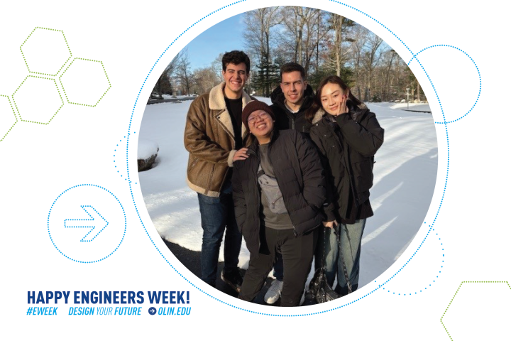Four international college students stand outside on Olin College's campus.