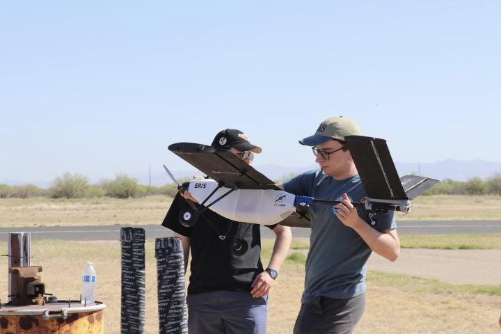 Olin AERO team in the field with their plane