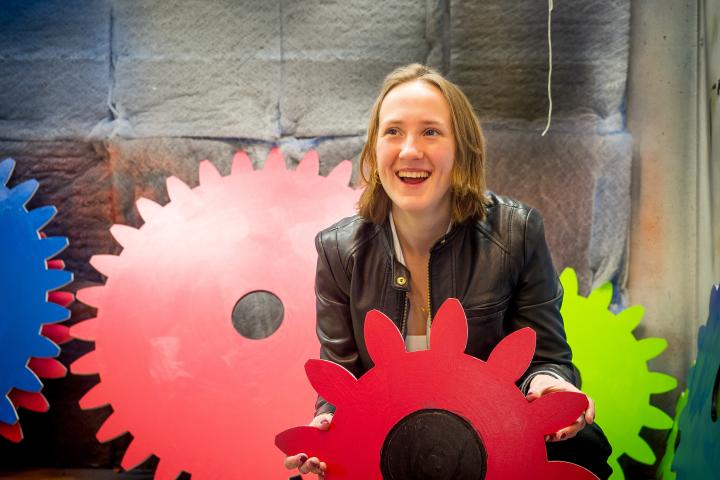 Portrait of Maya McKone-Sweet holding painted wooden gear in the LPB