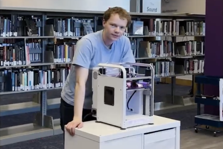 Olin senior, Rowan Jansens ‘25, a mechanical engineering major, is showing off his custom-designed and built 3D printer. 