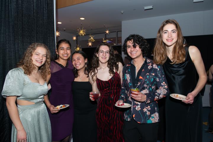 Six Olin students pose for a photo at the annual Spring Formal, held this year in Milas Hall, April 12, 2025.