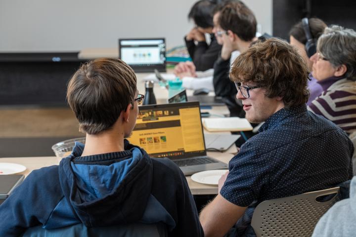 Timur Gray '28 talks with a hackathon teammate at the MIT-Ukraine "Building for Ukraine" hackathon.