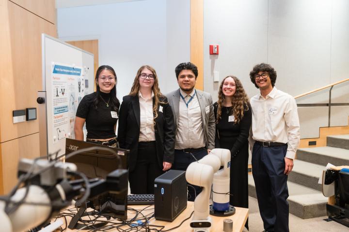 Amazon Robotics SCOPE Team 2025 Summit Five SCOPE students in front of poster at Summit