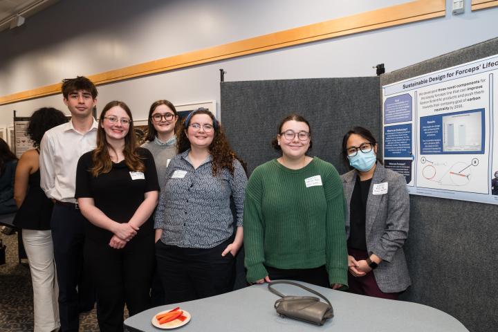 Boston Scientific SCOPE Team 2025 Students posing in front of project poster at Summit
