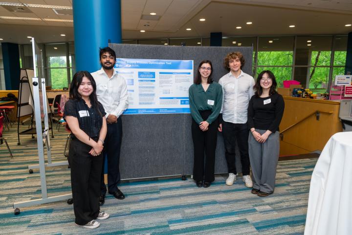 Pfizer SCOPE Team at Summit 2025 Students posing in front of project poster at Summit